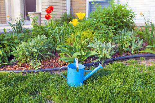 Gardening team preparing equipment in a residential garden